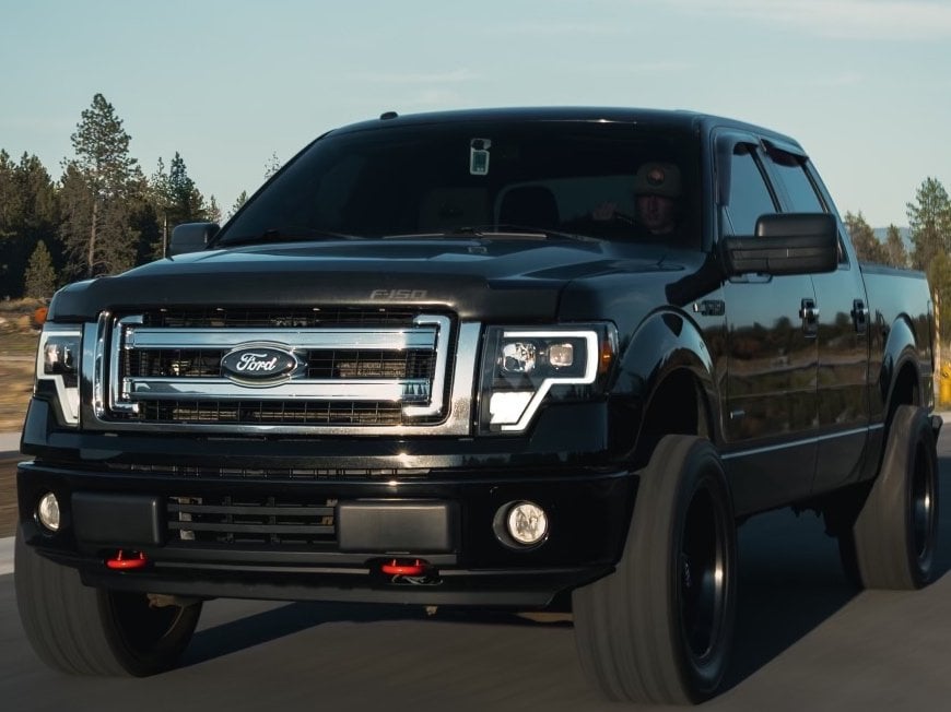 Raxiom Axial Series G4 Light Bar Switchback Projector Headlights; Black Housing; Clear Lens (09-14 F-150 w/ Factory Halogen Headlights)