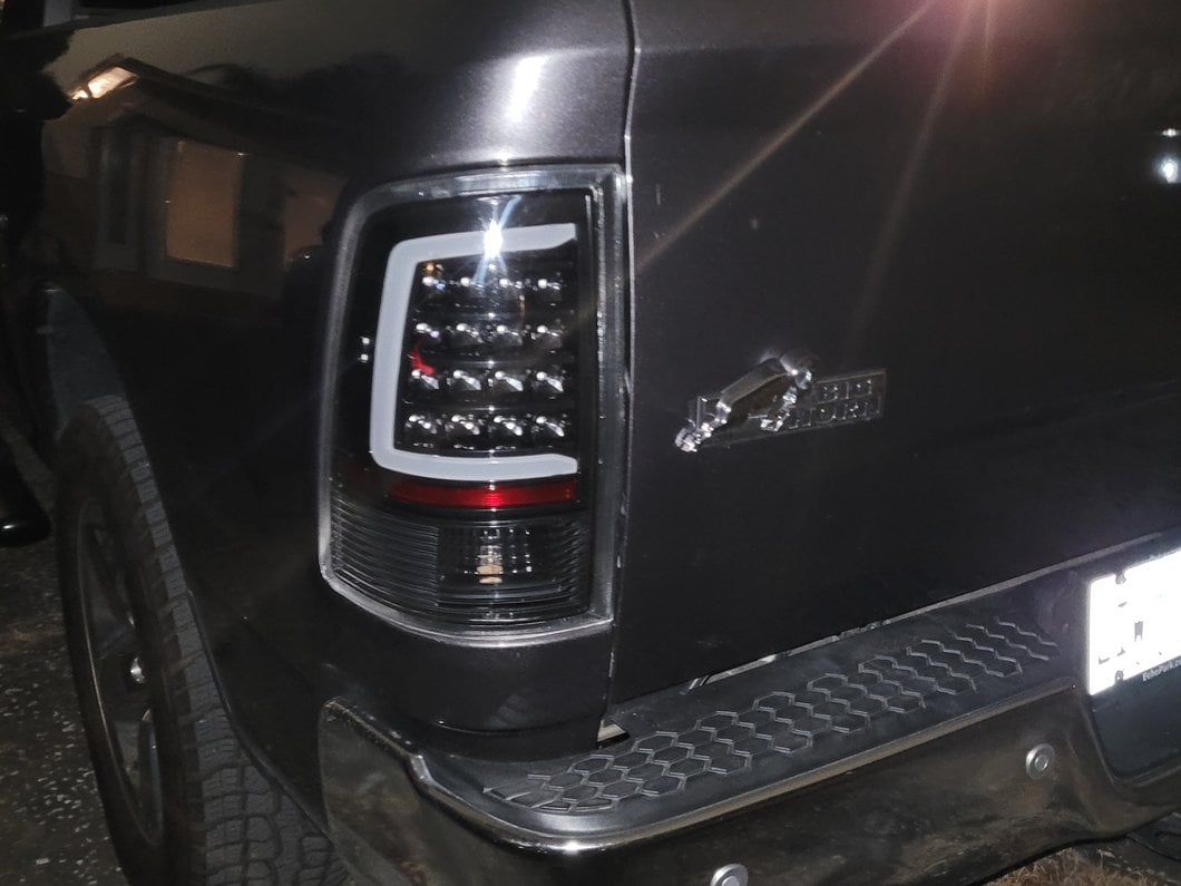 Raxiom Axial Series LED Tail Lights; Black Housing; Clear Lens (09-18 RAM 1500 w/ Factory Halogen Tail Lights)