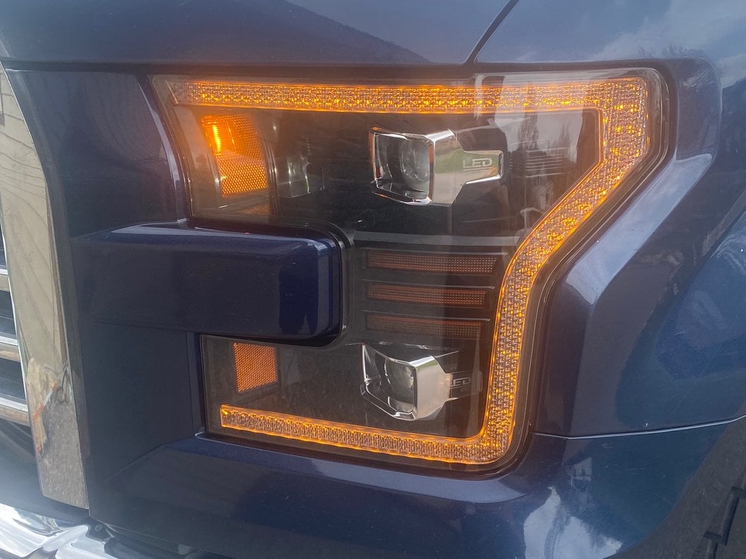 Raxiom LED Projector Headlights with LED Amber DRL; Black Housing; Clear Lens (15-17 F-150 w/ Factory Halogen Headlights)
