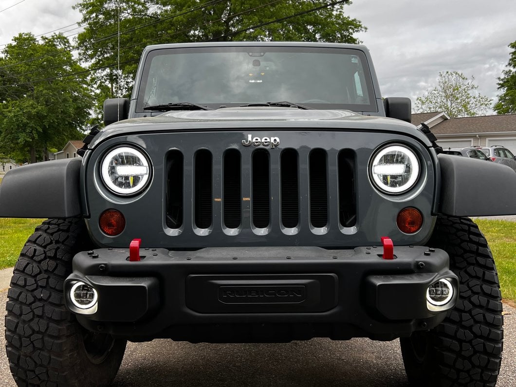 Raxiom 7-Inch LED Headlights with Halos; Black Housing; Clear Lens (97-18 Jeep Wrangler TJ & JK)
