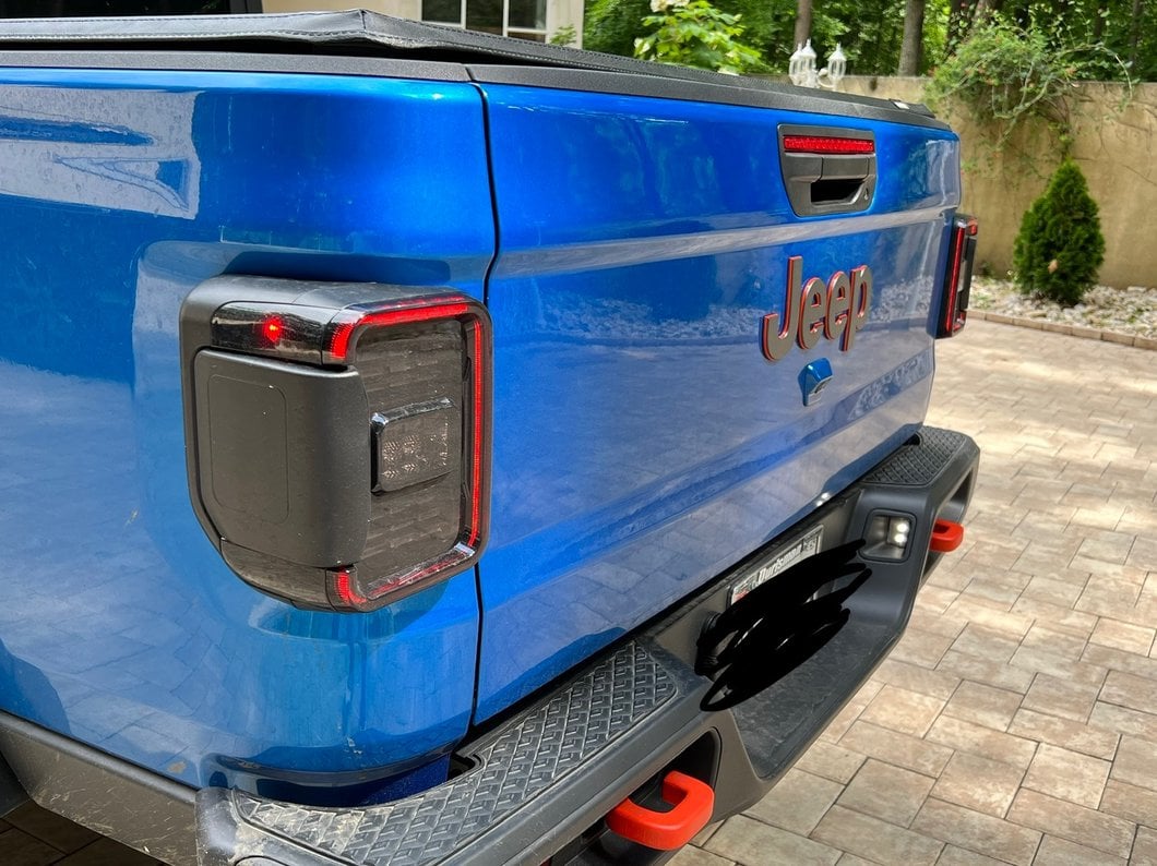 Raxiom LED Tail Lights; Black Housing; Smoked Lens (20-25 Jeep Gladiator JT w/ Factory Halogen Tail Lights & w/o Blind Spot Detection))