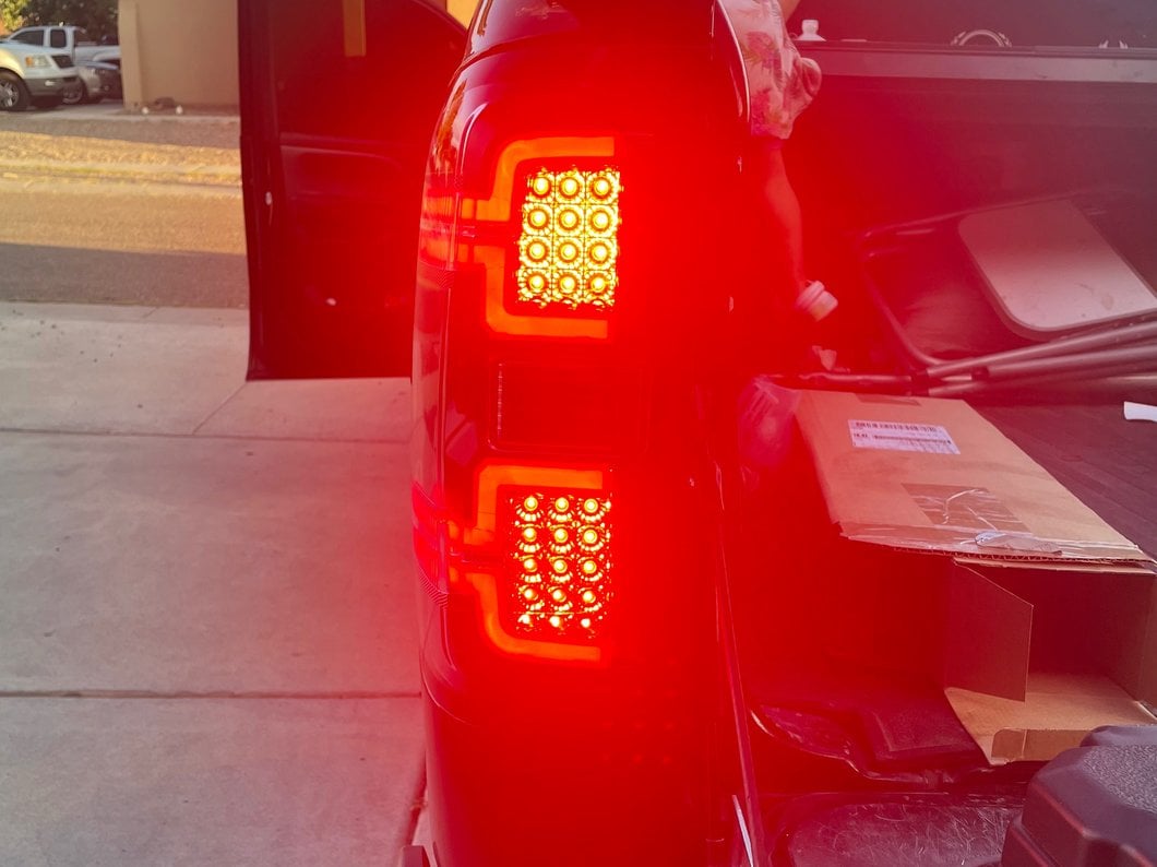 Raxiom LED Tail Lights with Sequential Turn Signals; Black Housing; Clear Lens (14-18 Silverado 1500 w/ Factory Halogen Tail Lights)