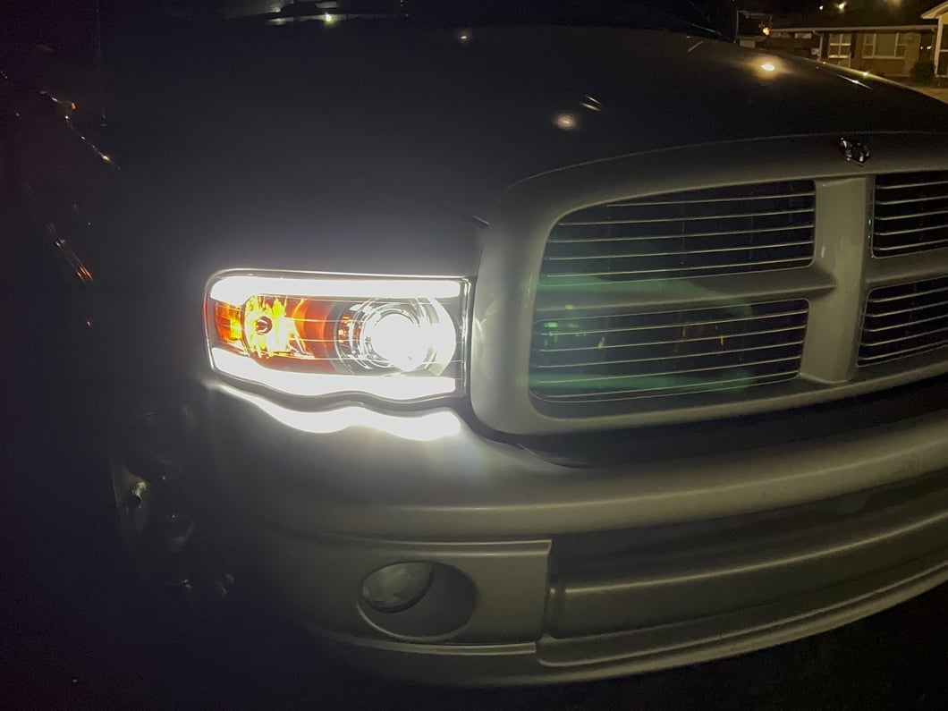 Raxiom Axial Series LED Projector Headlights with Sequential LED Bar; Black Housing; Clear Lens (02-05 RAM 1500)