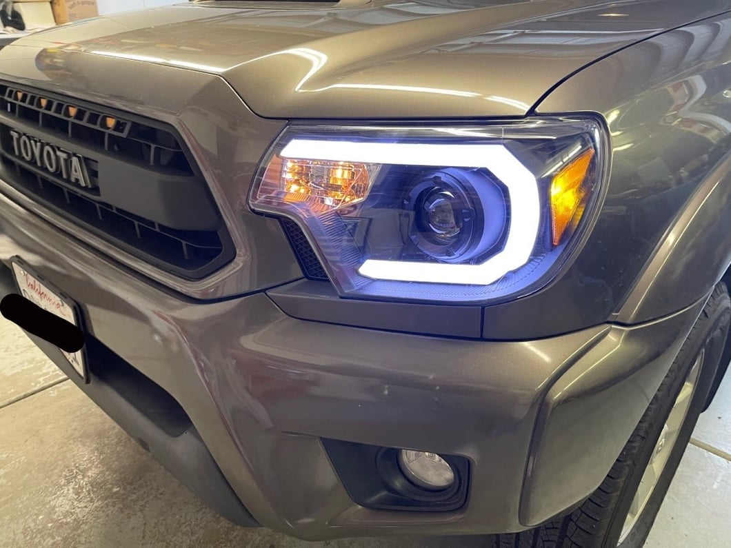 Raxiom Axial Series Projector Headlights with Sequential LED Bar; Black Housing; Clear Lens (12-15 Tacoma)