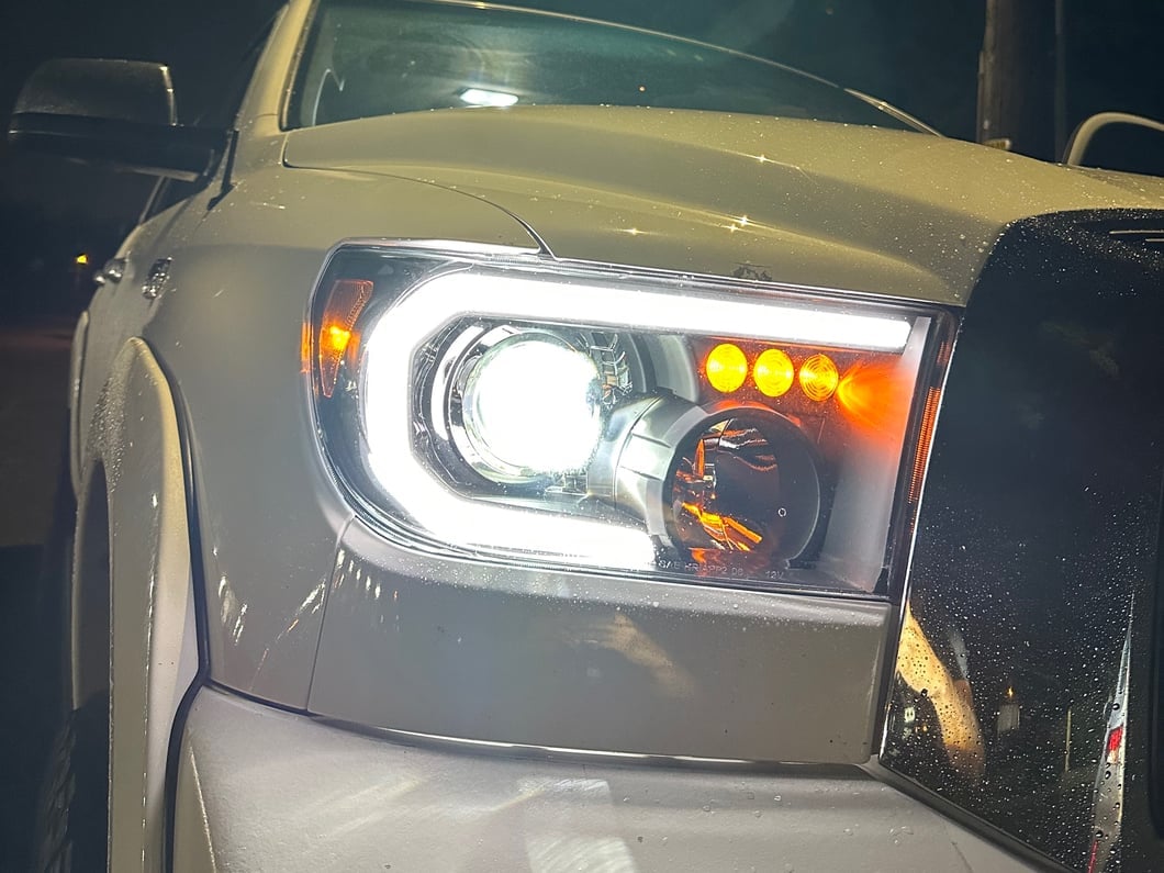 Raxiom Axial Series Projector Headlights with Sequential LED Bar; Black Housing; Clear Lens (07-13 Tundra w/o Level Adjuster)