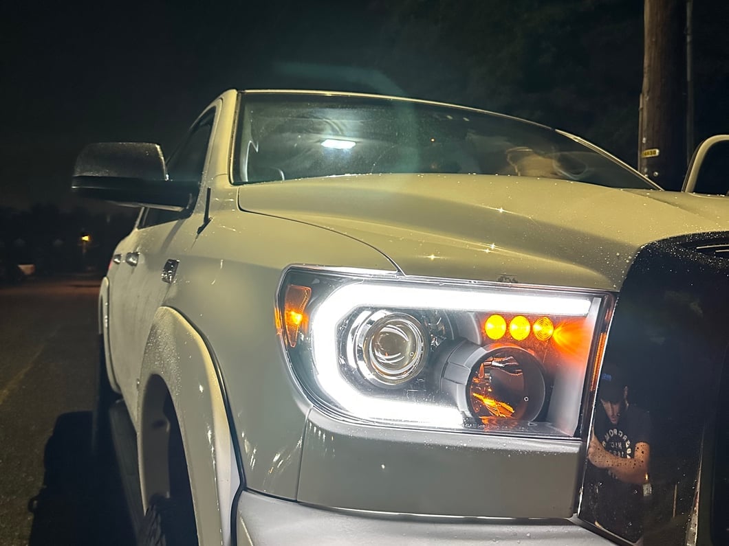 Raxiom Axial Series Projector Headlights with Sequential LED Bar; Black Housing; Clear Lens (07-13 Tundra w/o Level Adjuster)
