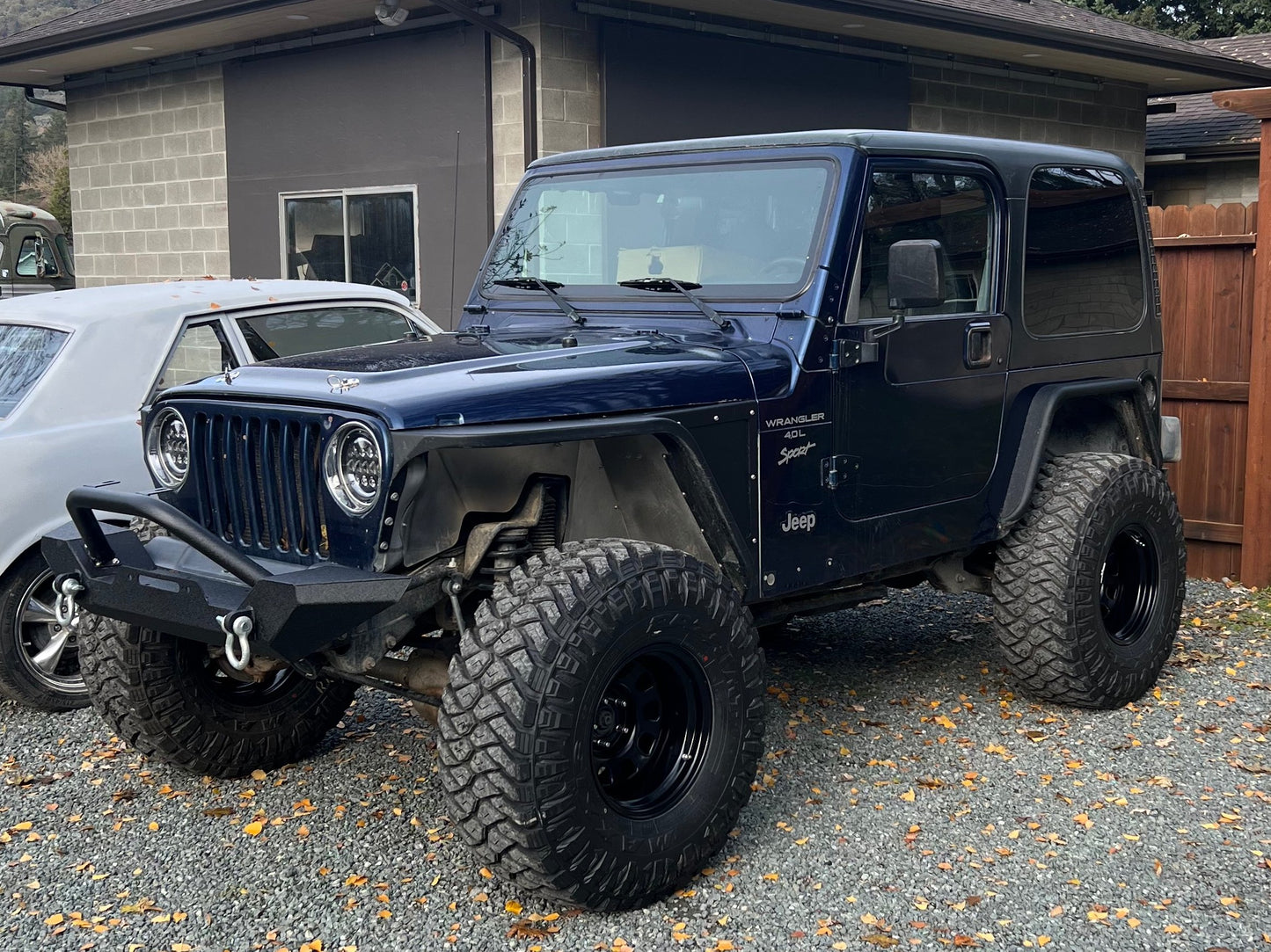Raxiom Gladiator LED Tail Lights; Black Housing; Smoked Lens (76-06 Jeep CJ7, Wrangler YJ & TJ)