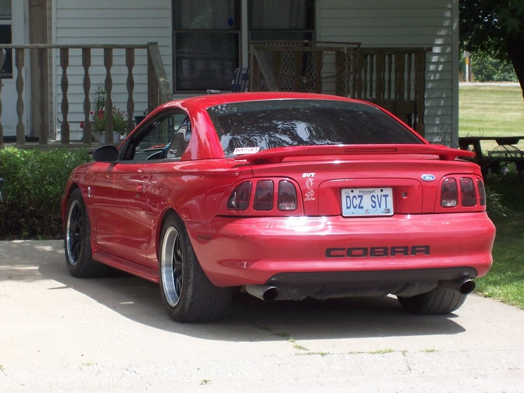 Raxiom Tail Lights; Black Housing; Smoked Lens (96-98 Mustang)