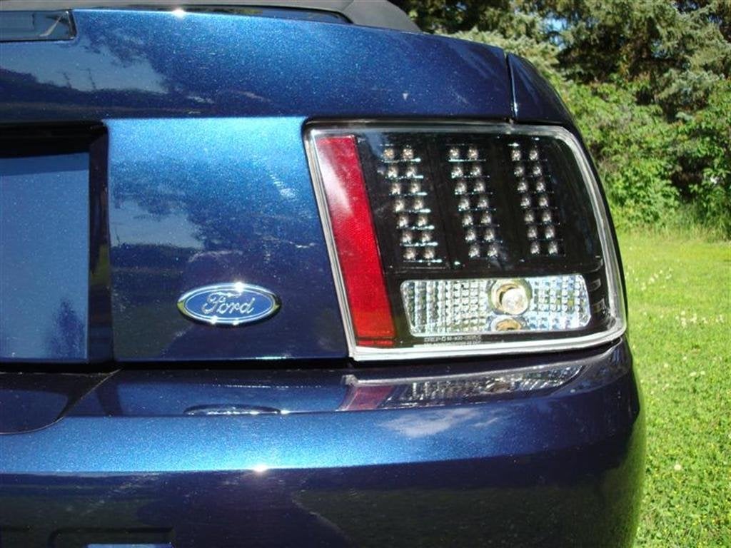 Raxiom Axial Series Projector Headlights and Black LED Tail Lights; Smoked (99-04 Mustang, Excluding Cobra)