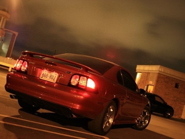 Raxiom Tail Lights; Black Housing; Smoked Lens (96-98 Mustang)