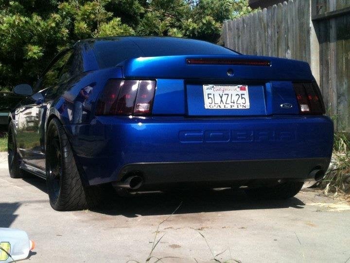 Raxiom Tail Lights; Black Housing; Smoked Lens (99-04 Mustang, Excluding 99-01 Cobra)