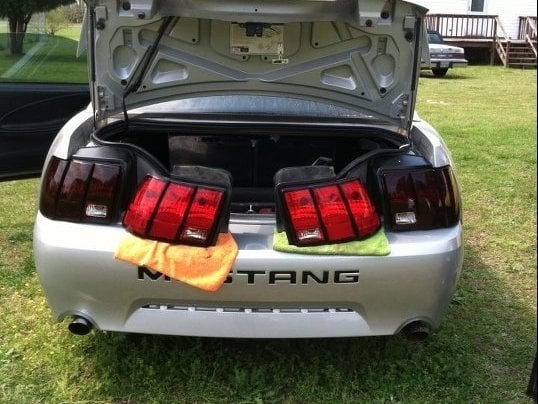 Raxiom Tail Lights; Black Housing; Smoked Lens (99-04 Mustang, Excluding 99-01 Cobra)