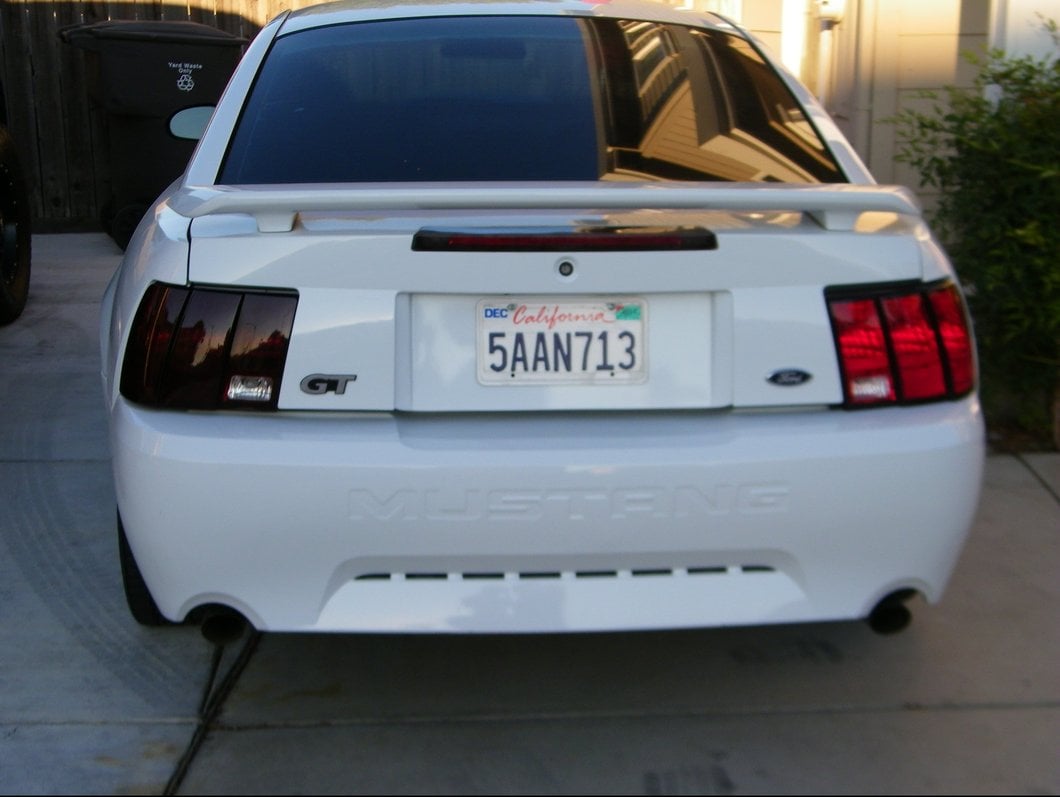 Raxiom Tail Lights; Black Housing; Smoked Lens (99-04 Mustang, Excluding 99-01 Cobra)
