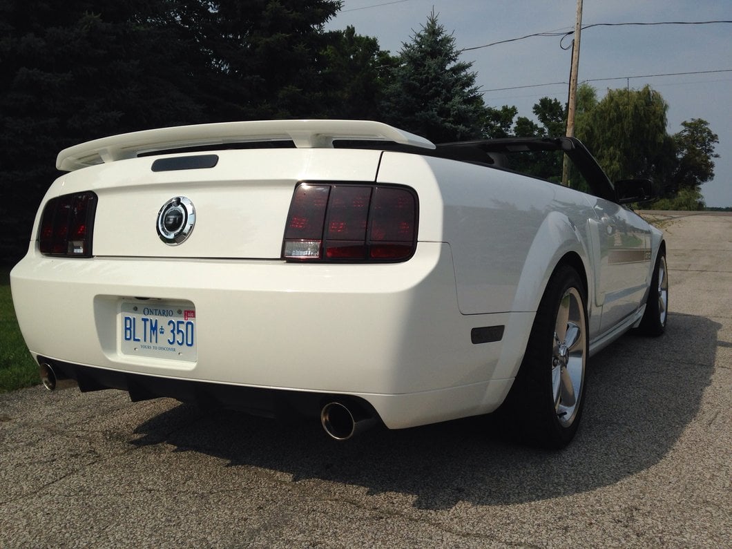 Raxiom Tail Lights and Sequential Tail Light Kit; Black Housing; Smoked Lens (05-09 Mustang)