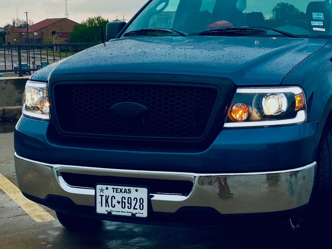 Raxiom Axial Series Projector Headlights with Sequential LED Bar; Black Housing; Clear Lens (04-08 F-150)