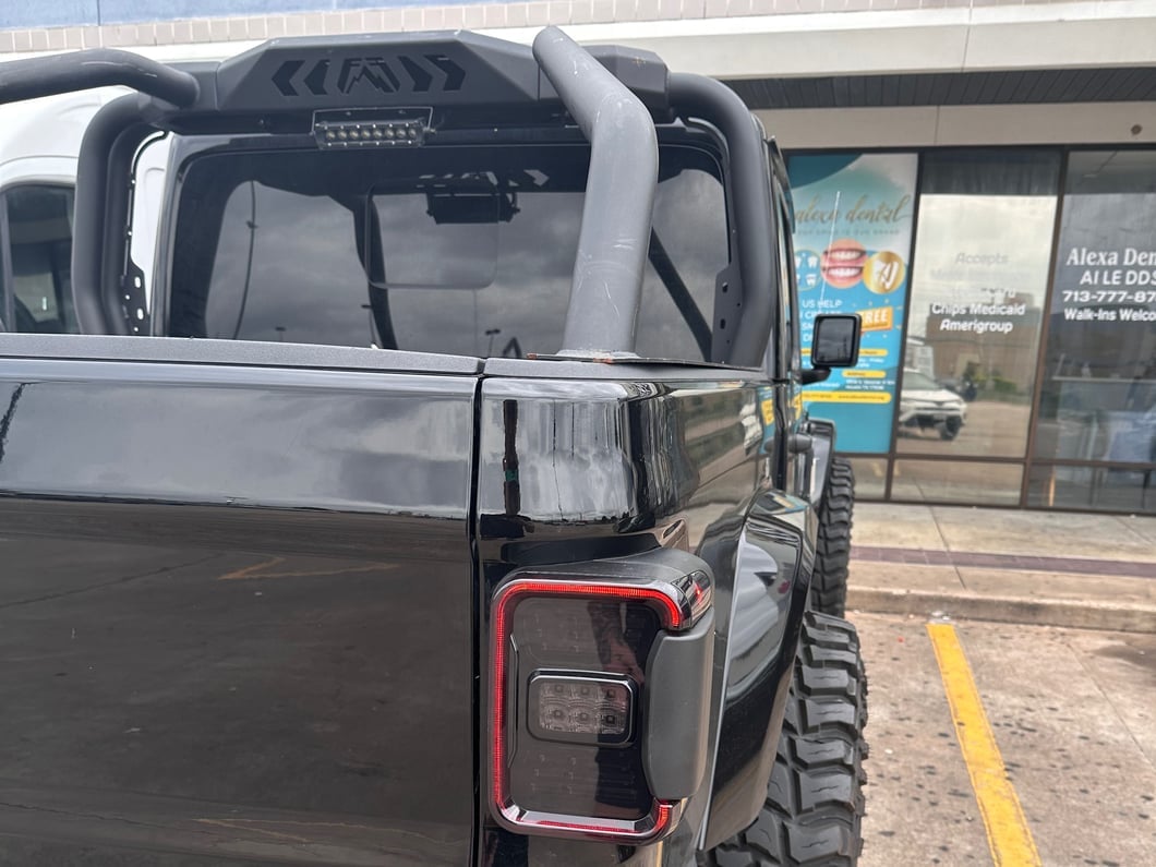 Raxiom LED Tail Lights; Black Housing; Smoked Lens (20-25 Jeep Gladiator JT w/ Factory Halogen Tail Lights & w/o Blind Spot Detection))