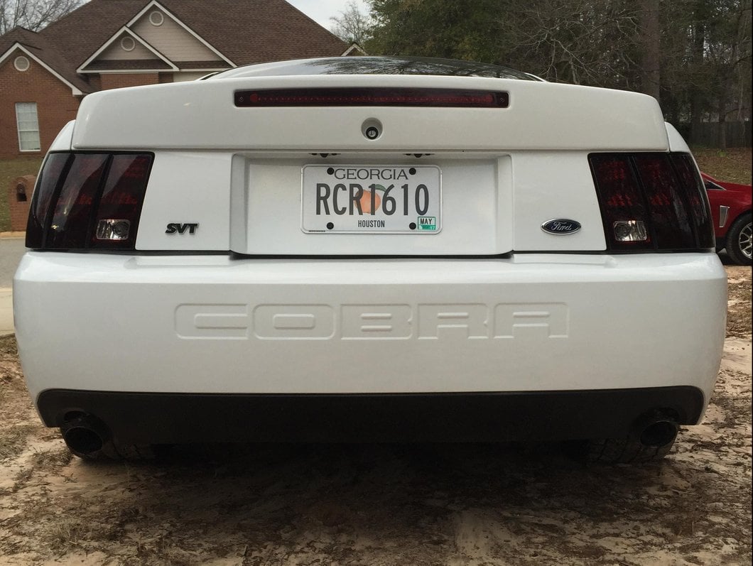Raxiom Tail Lights and Sequential Tail Light Kit; Black Housing; Smoked Lens (99-04 Mustang, Excluding 99-01 Cobra)