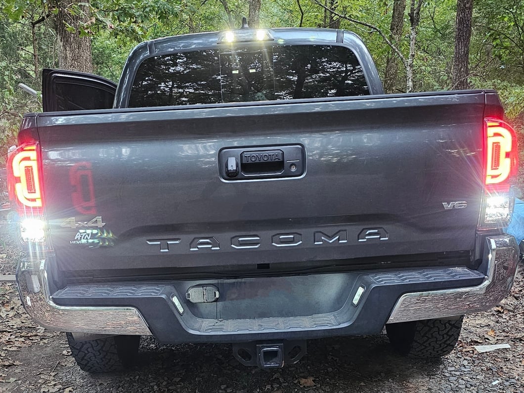 Raxiom XW Series Sequential LED Tail Lights; Black Housing; Clear Lens (16-23 Tacoma)