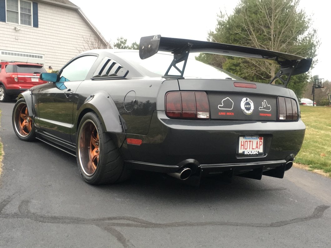 Raxiom Tail Lights and Sequential Tail Light Kit; Black Housing; Smoked Lens (05-09 Mustang)