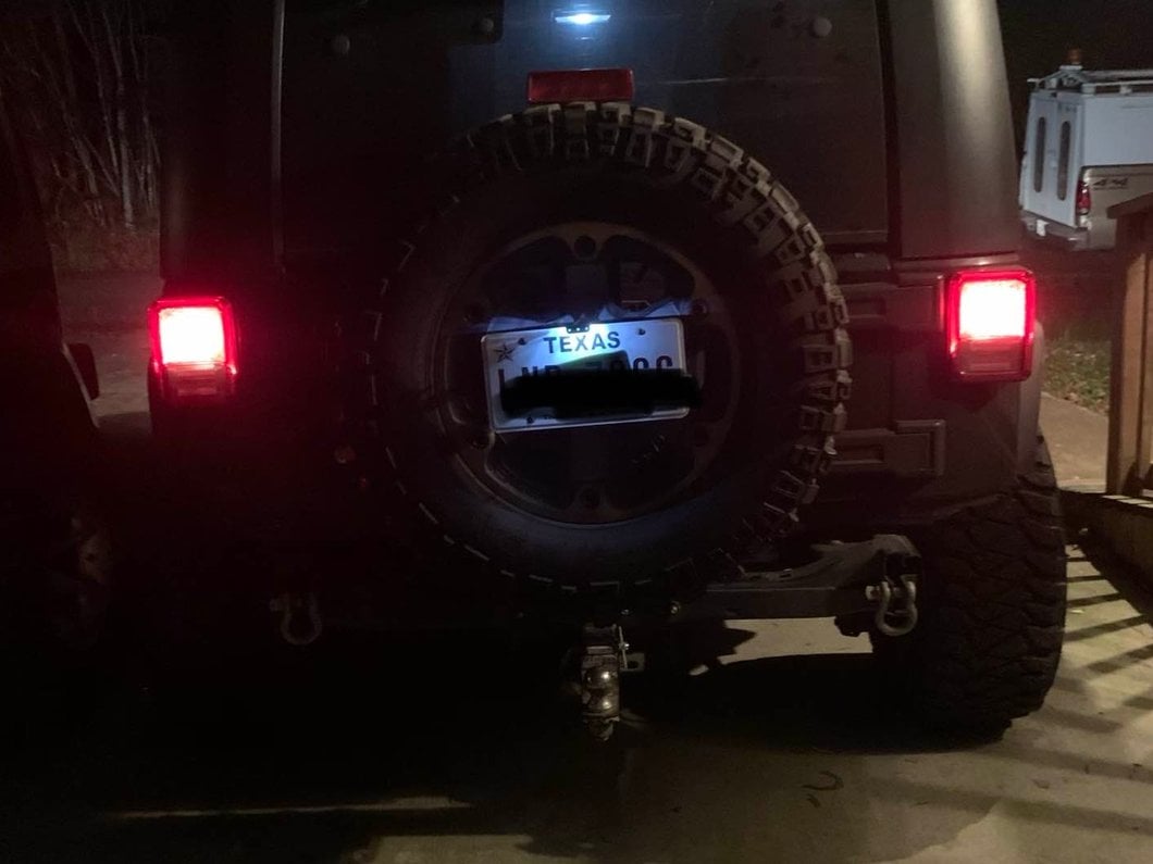 Raxiom Axial Series License Plate Bracket with LED Brake Light (07-18 Jeep Wrangler JK)