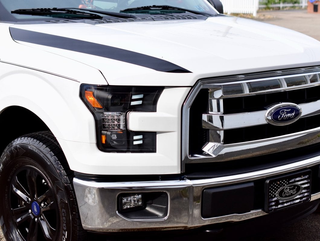 Raxiom LED Projector Headlights with Sequential Turn Signals; Black Housing; Clear Lens (15-17 F-150 w/ Factory Halogen Headlights)