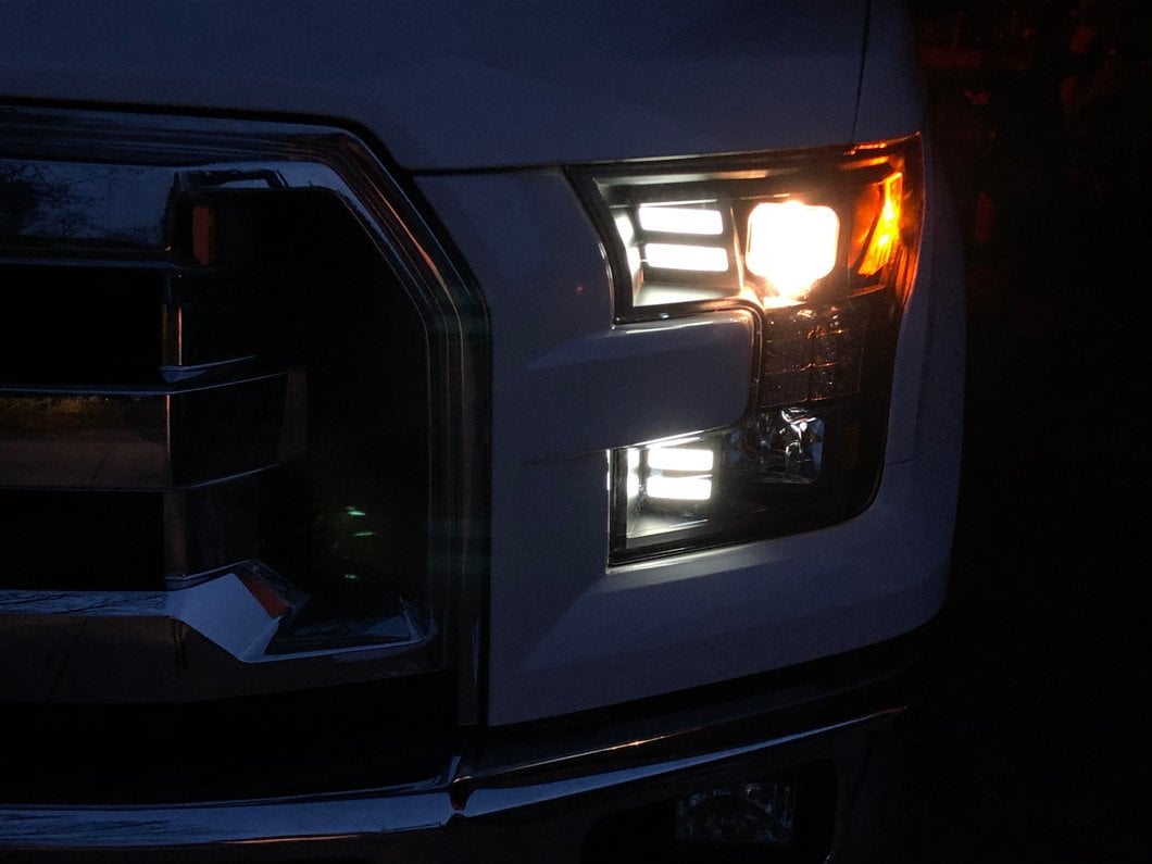 Raxiom LED Projector Headlights with Sequential Turn Signals; Black Housing; Clear Lens (15-17 F-150 w/ Factory Halogen Headlights)