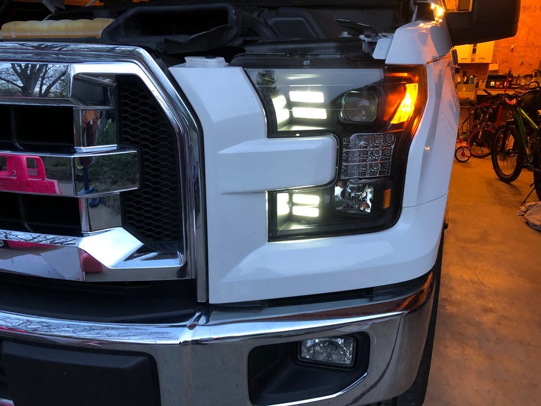 Raxiom LED Projector Headlights with Sequential Turn Signals; Black Housing; Clear Lens (15-17 F-150 w/ Factory Halogen Headlights)