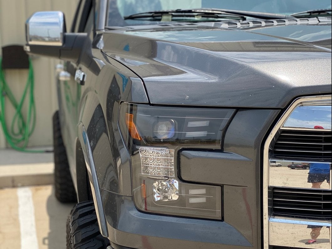Raxiom LED Projector Headlights with Sequential Turn Signals; Black Housing; Clear Lens (15-17 F-150 w/ Factory Halogen Headlights)