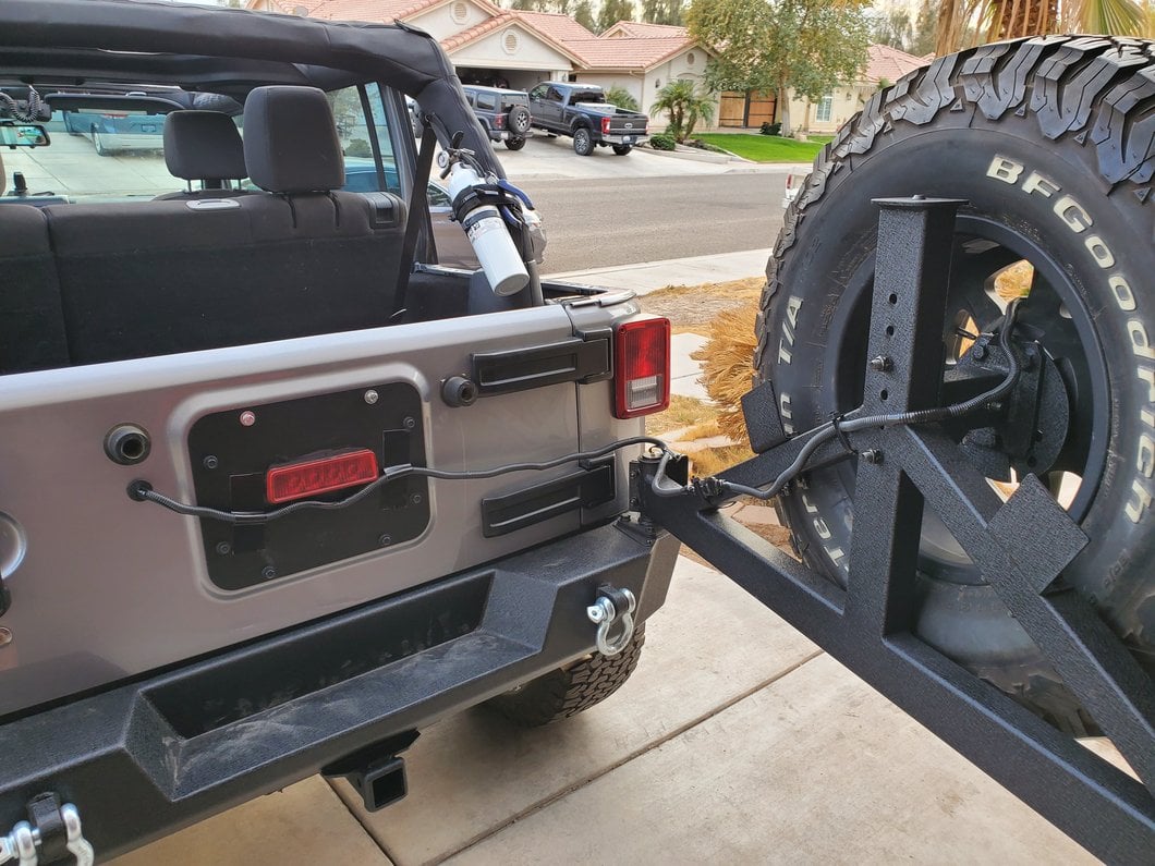 Raxiom Axial Series License Plate Bracket with LED Brake Light (07-18 Jeep Wrangler JK)