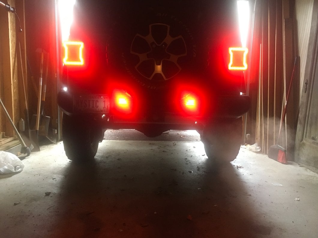 Raxiom Axial Series LED Rear Bumper Reflector Lights; Smoked (18-25 Jeep Wrangler JL Moab, Rubicon, Sahara)
