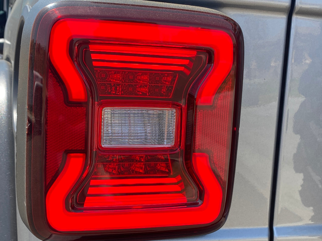 Raxiom LED Tail Lights; Black Housing; Red Lens (18-25 Jeep Wrangler JL w/ Factory Halogen Tail Lights & w/o Blind Spot Detection)