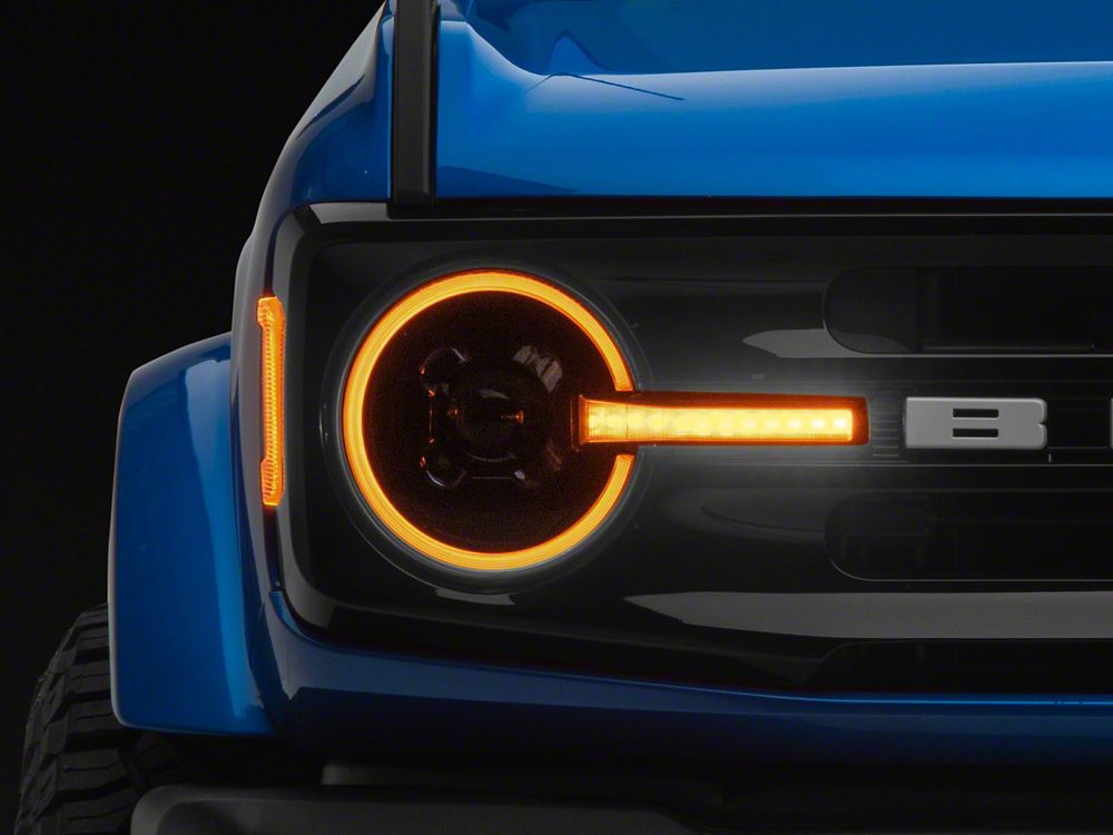 Raxiom LED Halo Headlights with Amber Backlight; Black Housing; Clear Lens (21-25 Bronco)