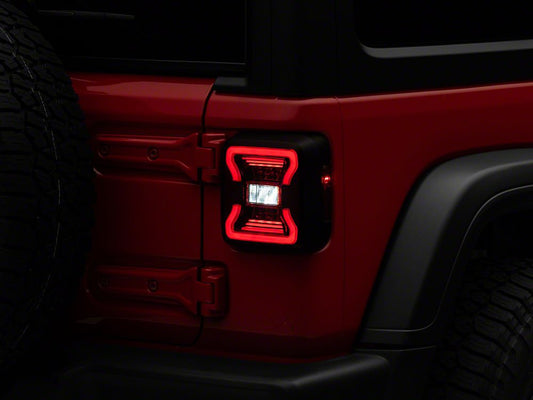 Raxiom LED Tail Lights; Black Housing; Red Lens (18-25 Jeep Wrangler JL w/ Factory Halogen Tail Lights & w/o Blind Spot Detection)