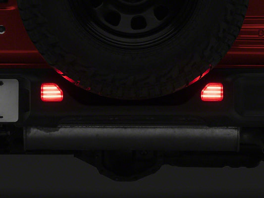 Raxiom Axial Series LED Rear Bumper Reflector Lights; Clear (18-25 Jeep Wrangler JL Moab, Rubicon, Sahara)