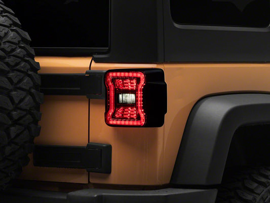 Raxiom Axial Series JL Style LED Tail Lights; Black Housing; Smoked Lens (07-18 Jeep Wrangler JK)