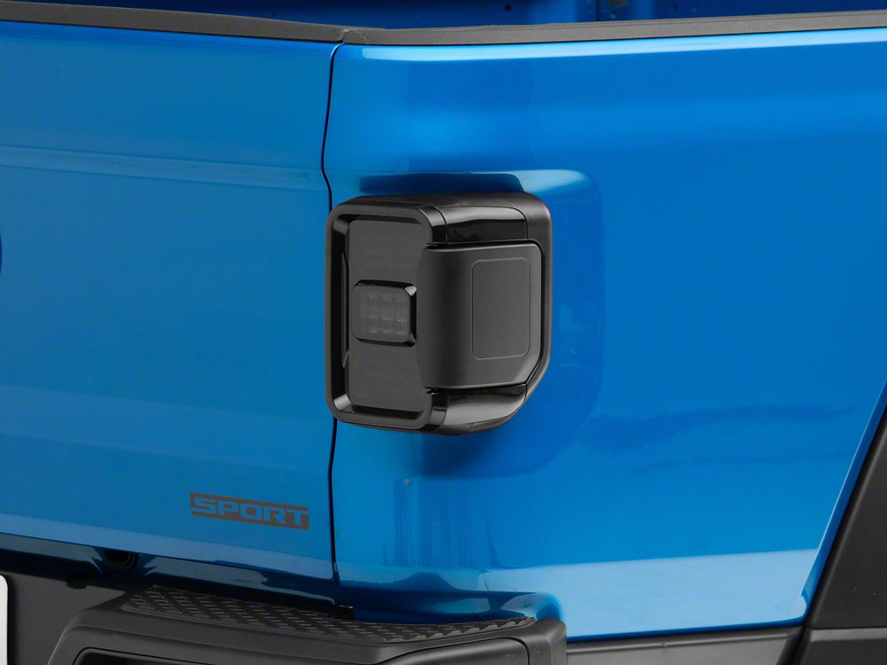 Raxiom LED Tail Lights; Black Housing; Smoked Lens (20-25 Jeep Gladiator JT w/ Factory Halogen Tail Lights & w/o Blind Spot Detection))