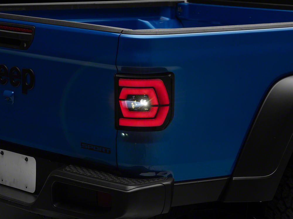 Raxiom Low Profile LED Tail Lights; Black Housing; Smoked Lens (20-25 Jeep Gladiator JT w/ Factory Halogen Tail Lights & w/o Blind Spot Detection))