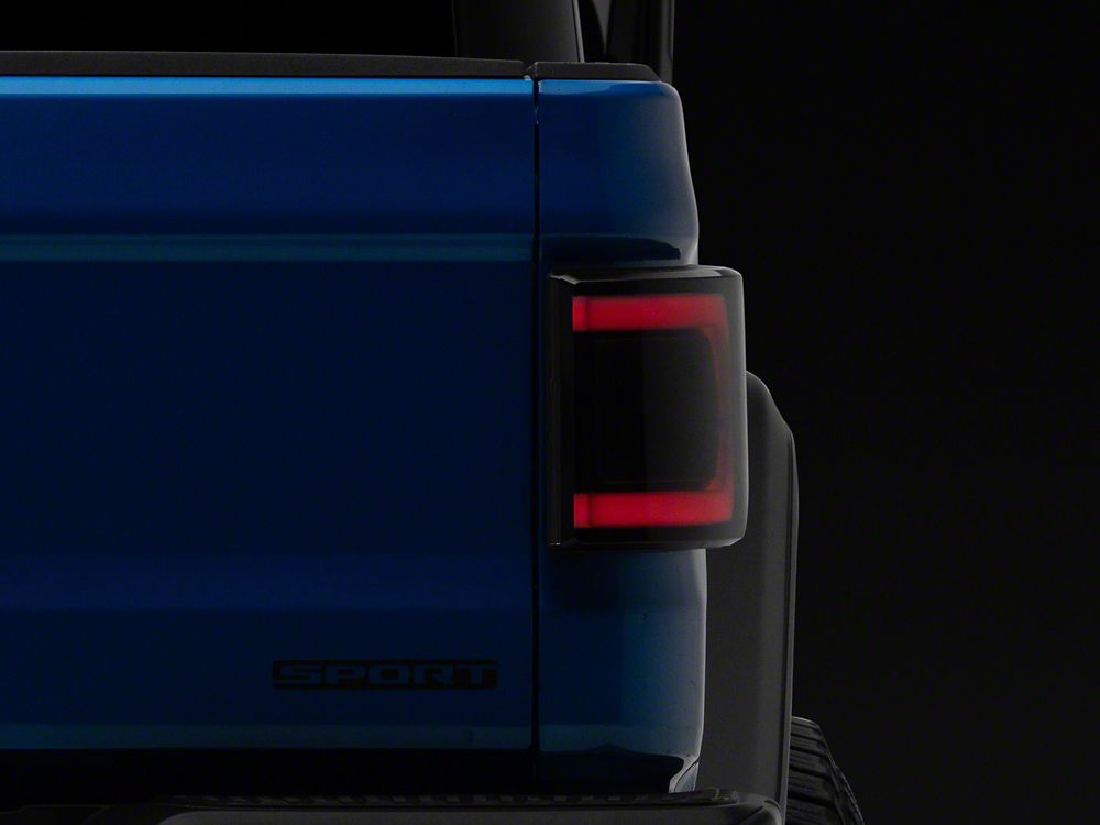 Raxiom Low Profile LED Tail Lights; Black Housing; Smoked Lens (20-25 Jeep Gladiator JT w/ Factory Halogen Tail Lights & w/o Blind Spot Detection))