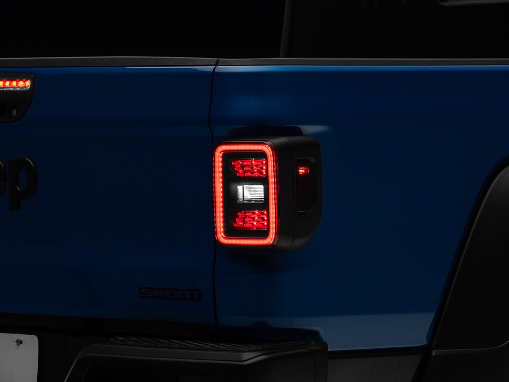 Raxiom LED Tail Lights; Black Housing; Smoked Lens (20-25 Jeep Gladiator JT w/ Factory Halogen Tail Lights & w/o Blind Spot Detection))