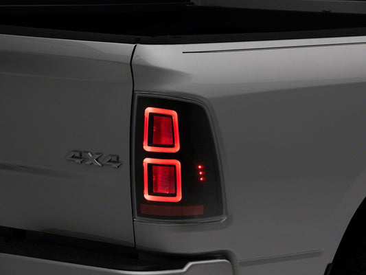 Raxiom LED Tail Lights; Black Housing; Clear Lens (09-18 RAM 1500 w/ Factory Halogen Tail Lights)