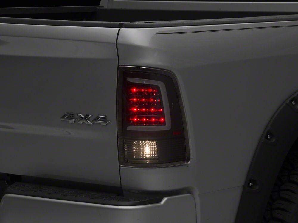 Raxiom Axial Series LED Tail Lights; Black Housing; Clear Lens (09-18 RAM 1500 w/ Factory Halogen Tail Lights)
