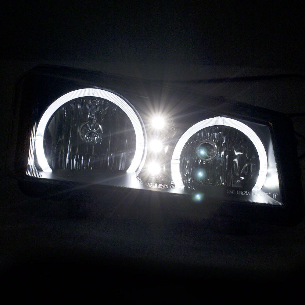 Raxiom Dual LED Halo Projector Headlights; Black Housing; Clear Lens (03-06 Silverado 1500)
