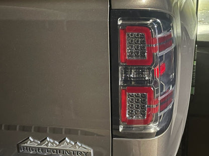 Raxiom LED Tail Lights with Sequential Turn Signals; Chrome Housing; Smoked Lens (14-18 Silverado 1500 w/ Factory Halogen Tail Lights)