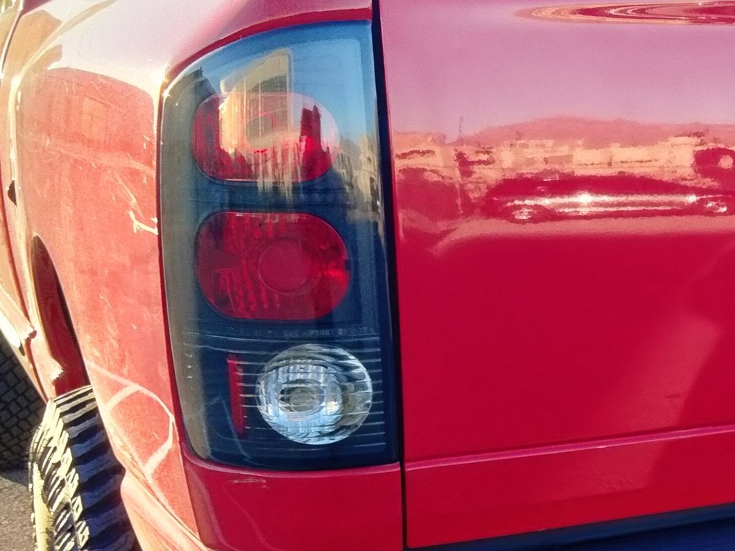 Raxiom Axial Series Tail Lights; Black Housing; Dark Smoked Lens (02-05 RAM 1500)