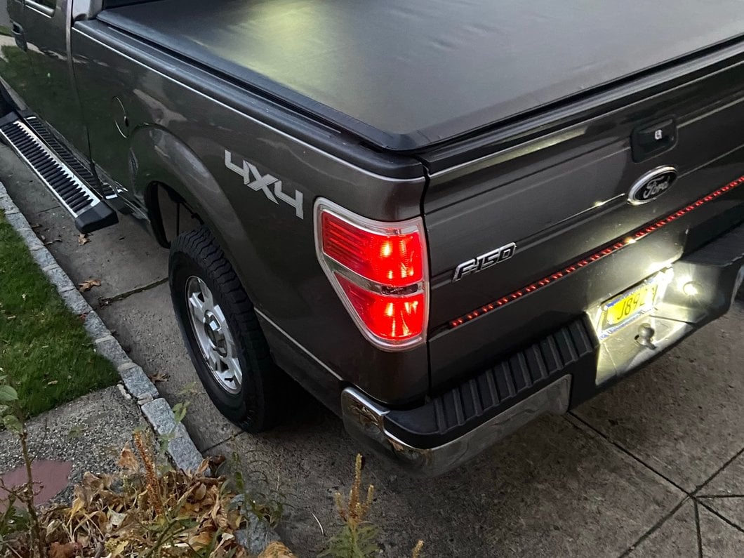 Raxiom Axial Series 60-Inch Tailgate LED Light Bar with Turn Signals and Reverse (Universal; Some Adaptation May Be Required)