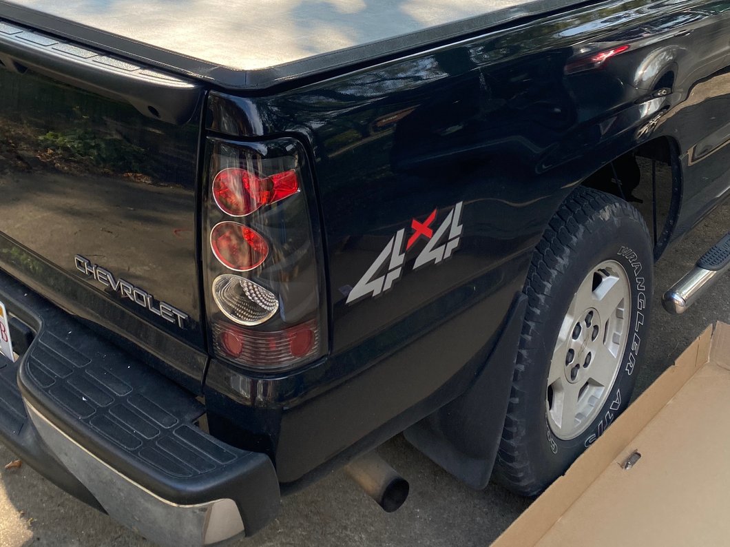 Raxiom Axial Series Tail Lights; Black Housing; Clear Lens (03-06 Silverado 1500 Fleetside)