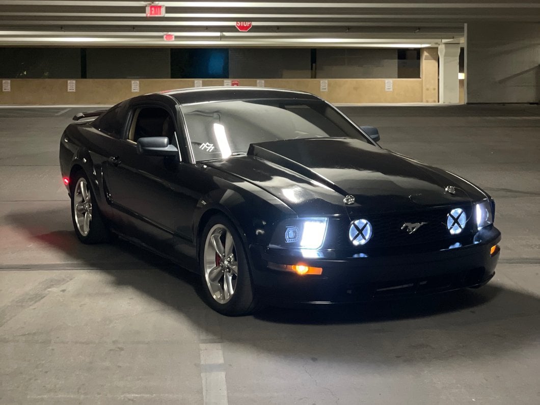 Raxiom Projector Headlights; Black Housing; Clear Lens (05-09 Mustang w/ Factory Halogen Headlights, Excluding GT500)