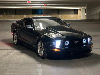 Raxiom Projector Headlights; Black Housing; Clear Lens (05-09 Mustang w/ Factory Halogen Headlights, Excluding GT500)
