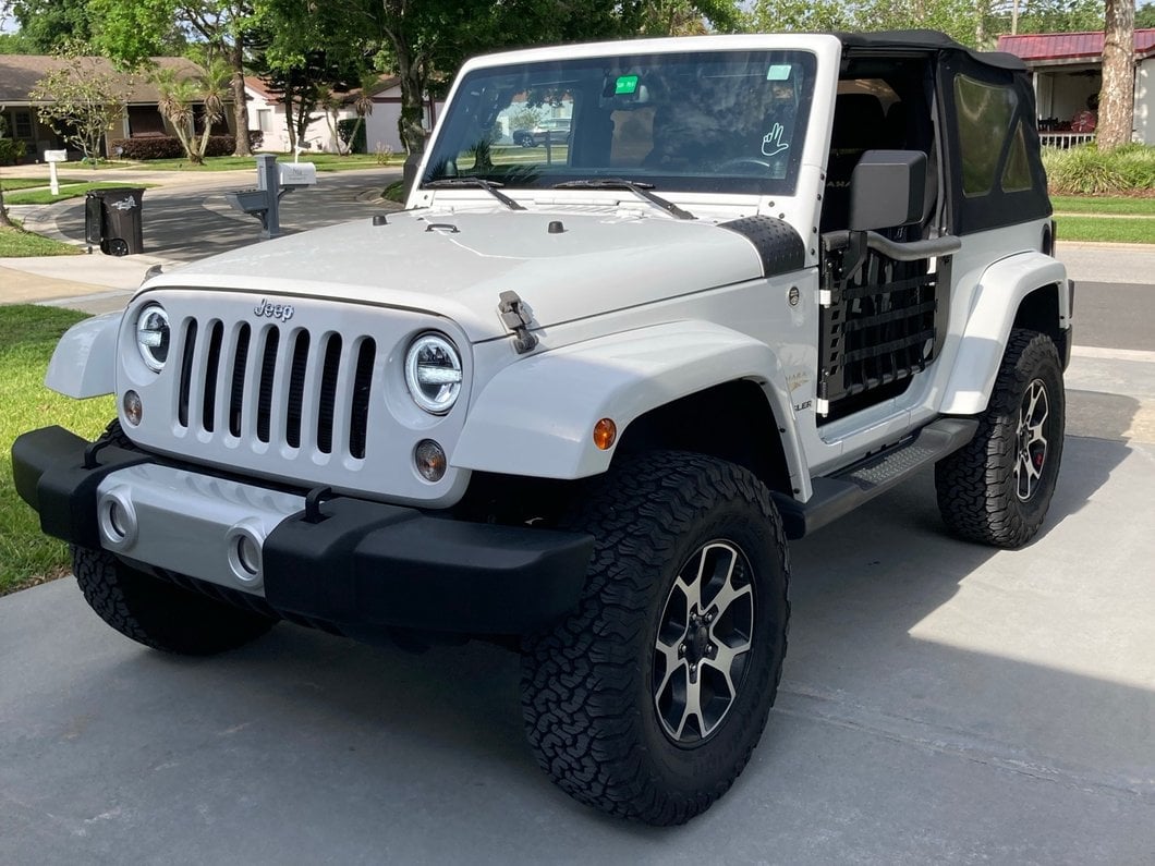 Raxiom 7-Inch LED Headlights with Halos; Black Housing; Clear Lens (97-18 Jeep Wrangler TJ & JK)