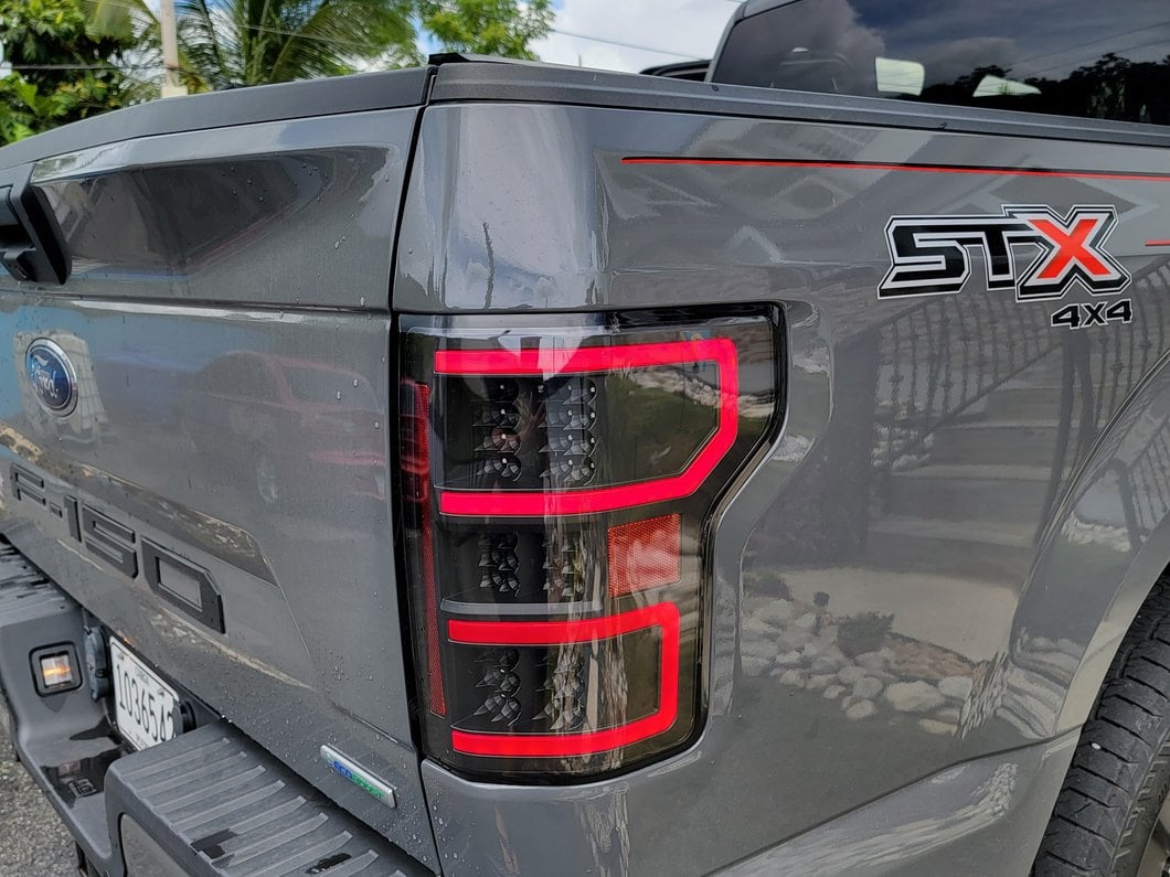 Raxiom LED Tail Lights; Black Housing; Clear Lens (18-20 F-150 w/ Factory Halogen Non-BLIS Tail Lights)